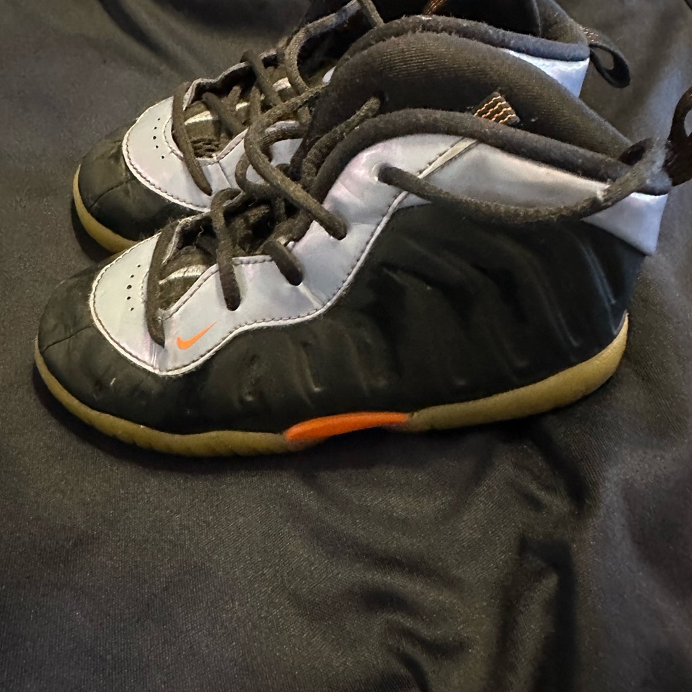 Foamposite Nike Kids Black and Silver Sneakers with Orange Accents